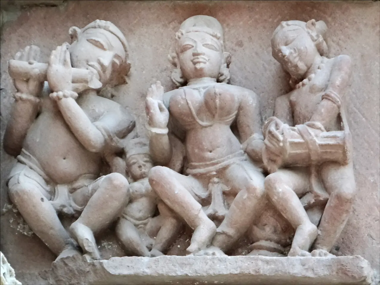 In this image I see 4 sculptures on the wall.