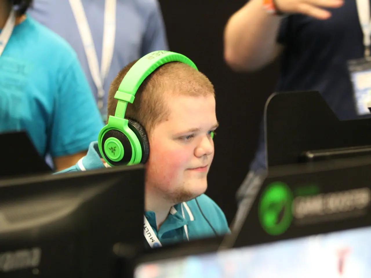 In this picture, we can see a few people, and a person with headset is highlighted, and we can see...