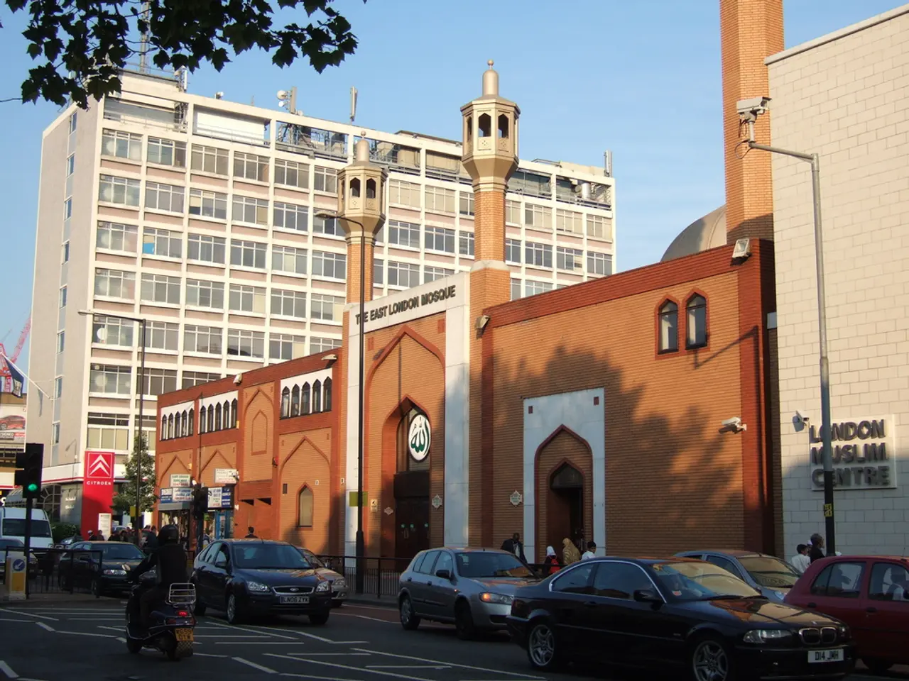 This looks like a building with the windows and the glass doors. I think this is a mosque. I can...
