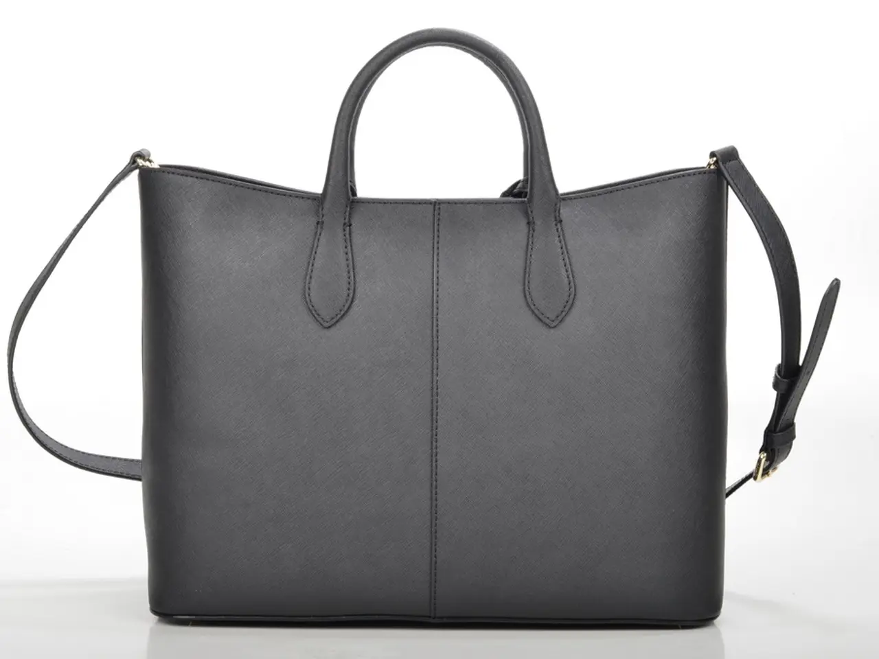 In this picture we can see a bag with belt and strap to it.