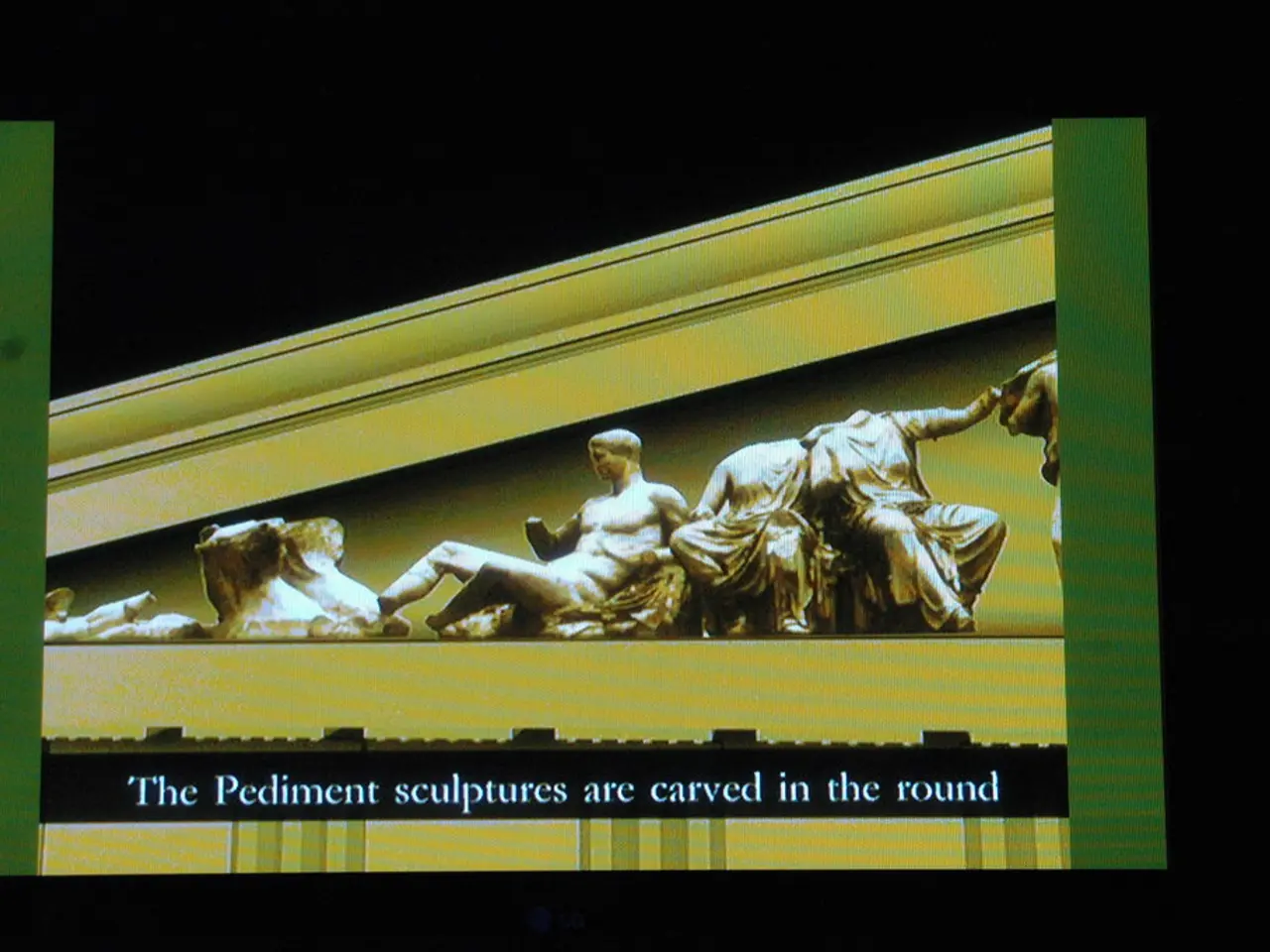 In this image it looks like a screen with text and image of sculptures.