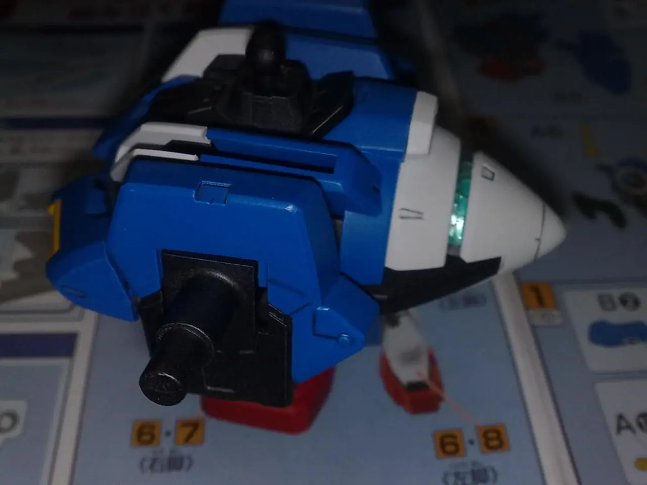In the image on the platform there are images and numbers on it. On the platform there is a toy...