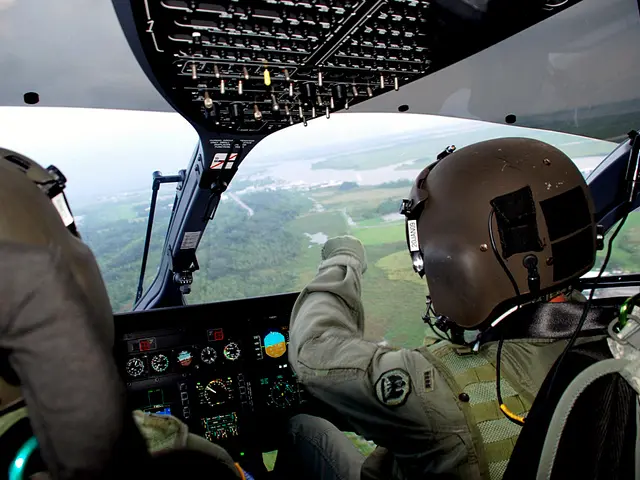 In this image, we can see a person sitting on chair inside an airplane. There is a control panel at...