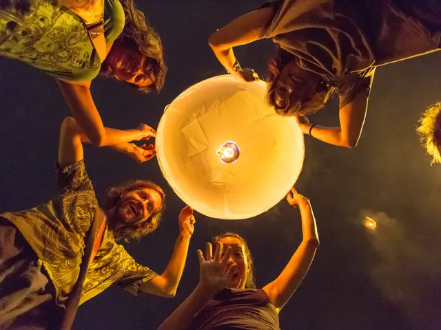 In this picture. I can see sky lanterns. I can see people with the smile. I can see clouds in the...