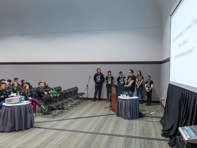 In this picture people are here for some meeting. In this we can see a person holding microphone...