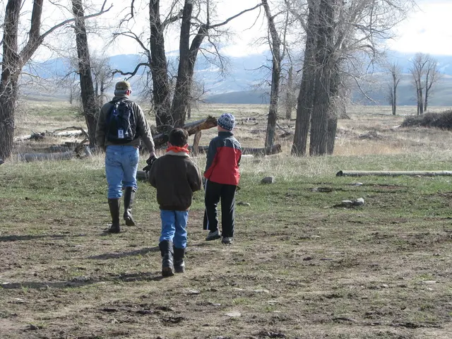 In the image we can see there are three people wearing clothes, boots and two of them are wearing a...