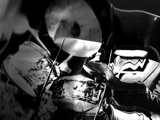 This is a black and white picture, it seems to be bags and a drum kit in the front.