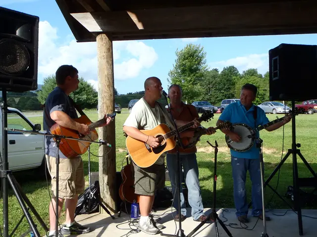 Here we can see a four people who are standing and they are playing a guitar and singing on a...